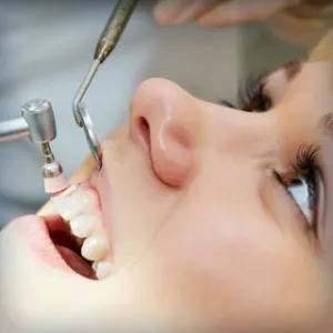 Girl having her teeth cleaned