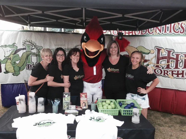 Staff of Hilgers Pediatric Dentistry with Cardinal mascot 