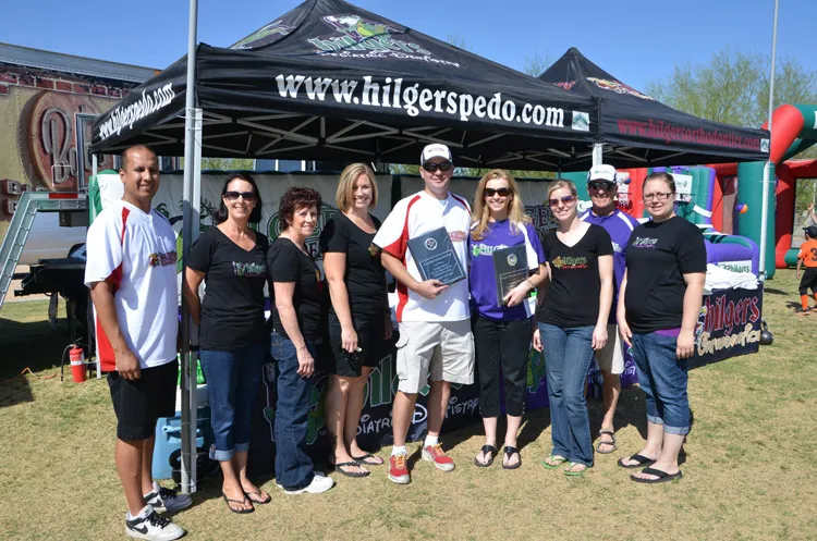 Hilges Pediatric Dentistry receiving an award at a Little League game