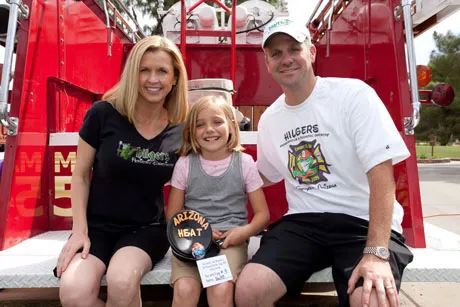 Drs. Kelly and Michael Hilgers with their daughter