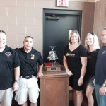 Doctors and staff of Hilgers Pediatric Dentistry with an award 