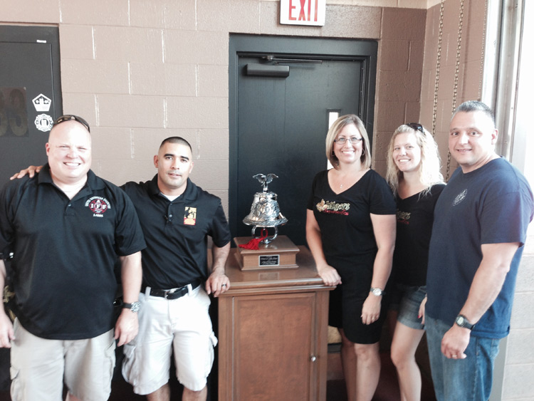 Doctors and staff of Hilgers Pediatric Dentistry with an award 